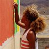 Girl painting a mural