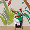 Boy pointing at mural