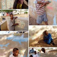 Children making murals in chalk